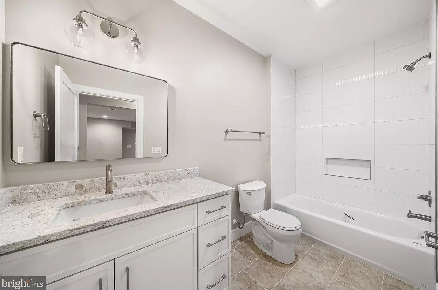 Full bathroom with granite vanity and tub-shower combination