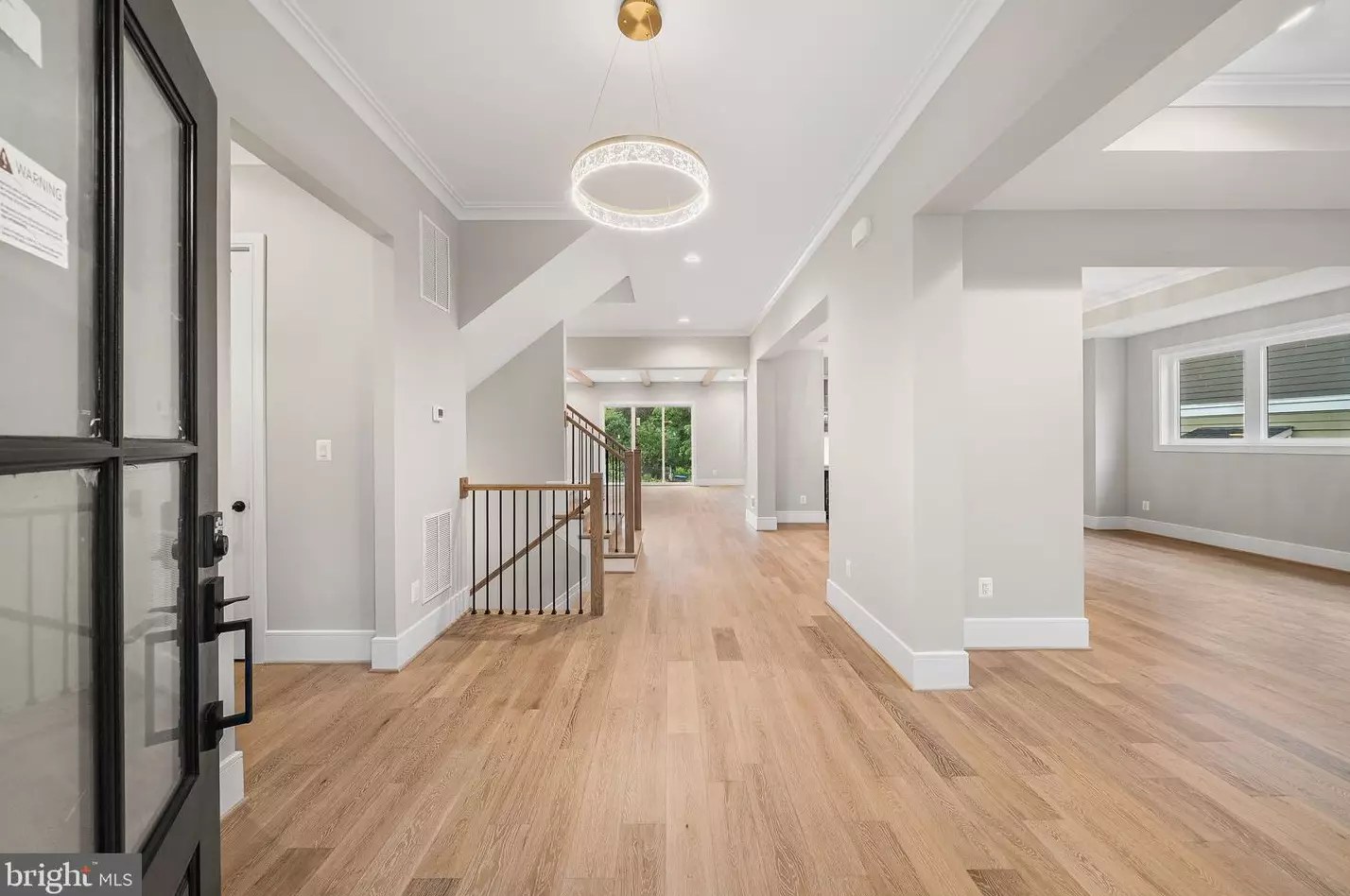 Entry foyer with European white oak flooring looking toward the Great Room